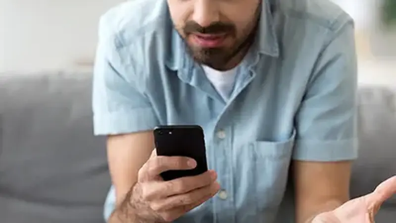 Person troubleshooting a smartphone problem